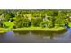 Lush landscaping surrounds this home, bordering the waterfront and creating a verdant oasis at 4365 Canal Rd, Lake Wales, FL 33898