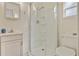 Well-lit bathroom with a glass-enclosed shower, vanity, and modern toilet at 4365 Canal Rd, Lake Wales, FL 33898
