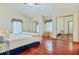 Spacious bedroom with hardwood floors, ample closet space, and large windows for natural light at 4365 Canal Rd, Lake Wales, FL 33898