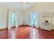 Bright bedroom with hardwood floors, large windows, and decorative shelving adding charm at 4365 Canal Rd, Lake Wales, FL 33898