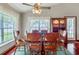 Inviting dining area with a wood table, chairs, and a decorative cabinet near a window with lake view at 4365 Canal Rd, Lake Wales, FL 33898