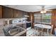 Classic kitchen with wood cabinets, white appliances, and cozy dining space at 4365 Canal Rd, Lake Wales, FL 33898