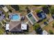 Overhead shot showcases community amenities, including pool, shaded courts, and building rooftops at 4940 Foxdale Dr, Lakeland, FL 33810