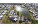 Birds-eye perspective of the community offering amenities, pond with fountain, and manicured landscaping at 4940 Foxdale Dr, Lakeland, FL 33810