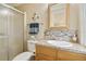 Bathroom featuring a shower stall, sink and attractive tiling at 4940 Foxdale Dr, Lakeland, FL 33810