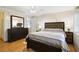 Primary bedroom featuring wood floors, furnishings and natural light at 4940 Foxdale Dr, Lakeland, FL 33810