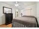 Comfortable bedroom featuring a comfortable bed and dark furnishings at 4940 Foxdale Dr, Lakeland, FL 33810