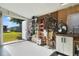 Organized garage space featuring a bike rack, ladder, utility storage, and access to outdoors at 4940 Foxdale Dr, Lakeland, FL 33810