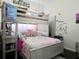 Fun, colorful bedroom with bunkbeds, a whimsical theme, and playful decor at 4962 Sweet Cedar Cir, Orlando, FL 32829