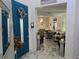 Inviting entryway with blue door, marble floors, and view into the living room at 4962 Sweet Cedar Cir, Orlando, FL 32829