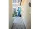 Inviting front entrance with a blue door, decorative plants, and a charming walkway at 4962 Sweet Cedar Cir, Orlando, FL 32829