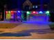 Attractive two-story home with landscape lighting, a well-manicured lawn, and a two-car garage at nighttime at 4962 Sweet Cedar Cir, Orlando, FL 32829