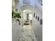 Arched hallway with marble floors leading to the dining and living areas at 4962 Sweet Cedar Cir, Orlando, FL 32829
