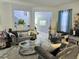 Comfortable living room with neutral paint, stylish furniture, and well-placed decor at 4962 Sweet Cedar Cir, Orlando, FL 32829