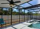 Enclosed pool area with fountain features, ceiling fan, and white privacy fence at 4962 Sweet Cedar Cir, Orlando, FL 32829
