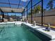 Secluded in-ground pool featuring a screened enclosure, lounge area, and decorative tile coping at 4962 Sweet Cedar Cir, Orlando, FL 32829