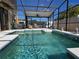 Relaxing pool with a screened lanai featuring comfortable seating and a ceiling fan overlooking the sparkling water at 4962 Sweet Cedar Cir, Orlando, FL 32829