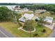 Aerial view of the home showing mature landscaping, the driveway, and neighborhood at 501 Main St, Lake Hamilton, FL 33851