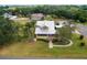 Aerial view of the home showing mature landscaping, and the front yard at 501 Main St, Lake Hamilton, FL 33851