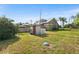 Green backyard featuring a shed and a partially fenced-in yard, enhancing the property's outdoor appeal at 501 Main St, Lake Hamilton, FL 33851