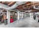 Spacious unfinished basement with exposed ductwork, painted brick columns, and concrete floors at 501 Main St, Lake Hamilton, FL 33851