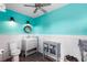 Charming bathroom with grey vanity, wood-look floors, and stylish accent wall at 501 Main St, Lake Hamilton, FL 33851