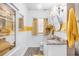 Stylish bathroom with granite counters, wood look tile floors, and modern fixtures at 501 Main St, Lake Hamilton, FL 33851