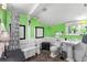 A unique bathroom with a clawfoot tub, pedestal sink, and bright green walls offers vintage charm at 501 Main St, Lake Hamilton, FL 33851
