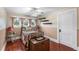 This cozy bedroom offers hardwood floors, natural light, and decorative shelves at 501 Main St, Lake Hamilton, FL 33851