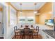 Cozy breakfast nook with sunny yellow walls and custom built in bench seating at 501 Main St, Lake Hamilton, FL 33851