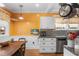 Well-equipped kitchen with granite countertops, stainless steel appliances, and a cozy dining area at 501 Main St, Lake Hamilton, FL 33851