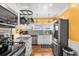 Modern kitchen featuring stainless steel appliances, granite countertops, and an eat-in area at 501 Main St, Lake Hamilton, FL 33851