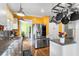 Modern kitchen with stainless steel appliances, granite countertops, and an open layout at 501 Main St, Lake Hamilton, FL 33851