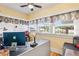 Bright home office with hardwood floors, custom window coverings, and a large desk at 501 Main St, Lake Hamilton, FL 33851