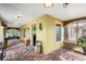 Enclosed porch with brick flooring and neutral colors, offering a tranquil outdoor space at 501 Main St, Lake Hamilton, FL 33851