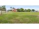 Large grassy yard with chain link fence surrounding the property at 501 Main St, Lake Hamilton, FL 33851