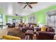 Comfortable living room with hardwood floors, ceiling fan, and ample natural light at 501 Main St, Lake Hamilton, FL 33851