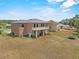 Aerial view of the home and property, showcasing the large yard and surrounding landscape at 524 Nogales, Kissimmee, FL 34758