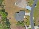 Birds eye view of home with a large backyard, nearby homes and a winding road at 524 Nogales, Kissimmee, FL 34758
