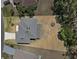 An aerial view of a well-maintained home on a large lot with a fenced in backyard at 524 Nogales, Kissimmee, FL 34758