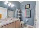 Cozy bathroom featuring a vanity, toilet and a tub and shower combo with nautical themed curtain at 524 Nogales, Kissimmee, FL 34758