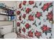 Cozy bathroom features a shower with decorative floral curtain at 524 Nogales, Kissimmee, FL 34758