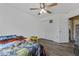 Bedroom with wood-look flooring, ceiling fan, and closet at 524 Nogales, Kissimmee, FL 34758