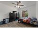 Cozy bedroom with ceiling fan, black dressers, and ample natural light at 524 Nogales, Kissimmee, FL 34758