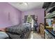 Comfortable bedroom featuring a ceiling fan, tile floors and bright, painted walls at 524 Nogales, Kissimmee, FL 34758
