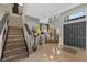 Inviting tiled foyer features a dining area, staircase, and a decorative rug at 524 Nogales, Kissimmee, FL 34758