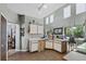 Bright kitchen features tiled floors, white cabinets, and access to the dining area at 524 Nogales, Kissimmee, FL 34758