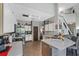 Bright kitchen with stainless steel appliances, tile floors and an island at 524 Nogales, Kissimmee, FL 34758