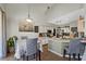 Open kitchen and dining area with modern appliances and bar-style seating at 524 Nogales, Kissimmee, FL 34758