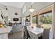 Open-concept living area features large windows, sliding glass doors, and modern decor at 524 Nogales, Kissimmee, FL 34758